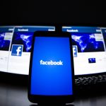 The loading screen of the Facebook application on a mobile phone is seen in this photo illustration taken in Lavigny